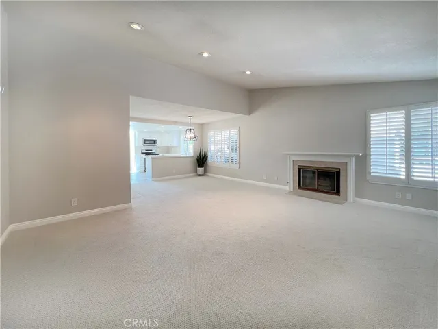 a view of a livingroom and a fireplace