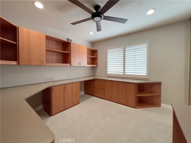 a kitchen with a cabinets and window