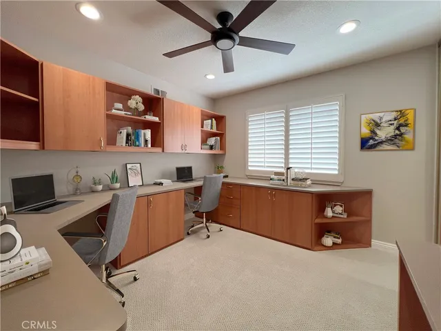 a workspace with furniture and a window