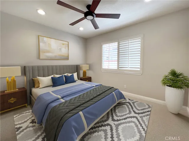 a bedroom with bed and a window