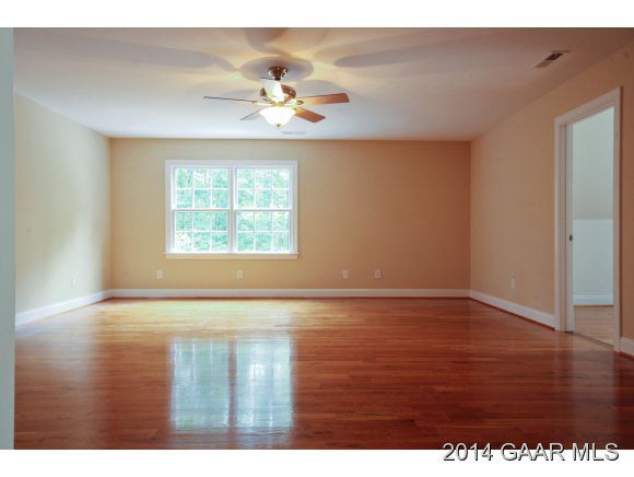 1834 Hermitage Road Waynesboro, VA 22980 - Photo 19 of 32 a view of an empty room with wooden floor and a window