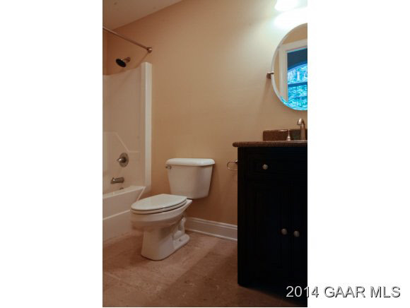 1834 Hermitage Road Waynesboro, VA 22980 - Photo 23 of 32 a bathroom with a toilet and a shower curtain