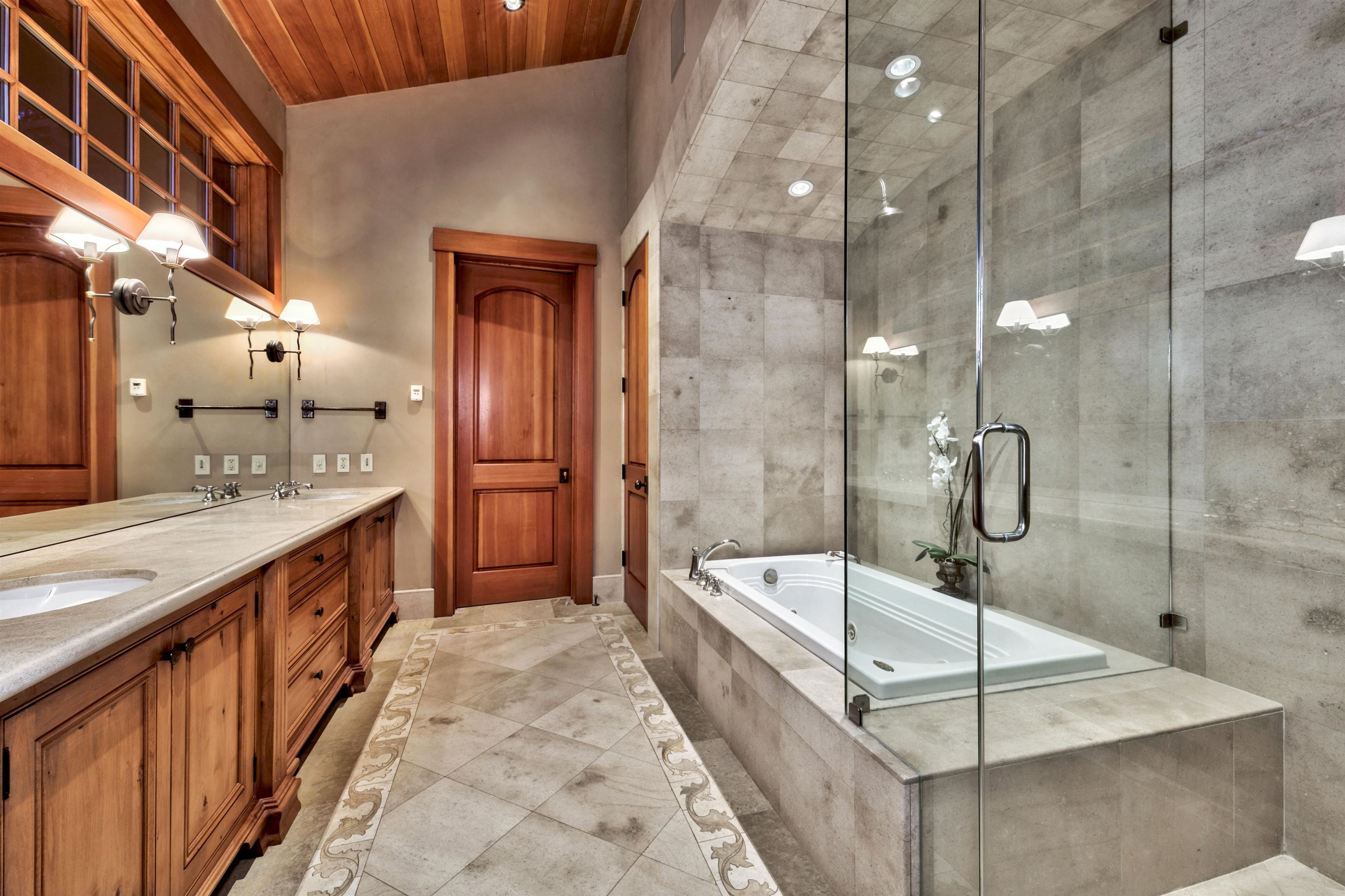 244 Hidden Lake Loop Olympic Valley, CA 96146 - Photo 12 of 20 a bathroom with a tub sink shower and mirror