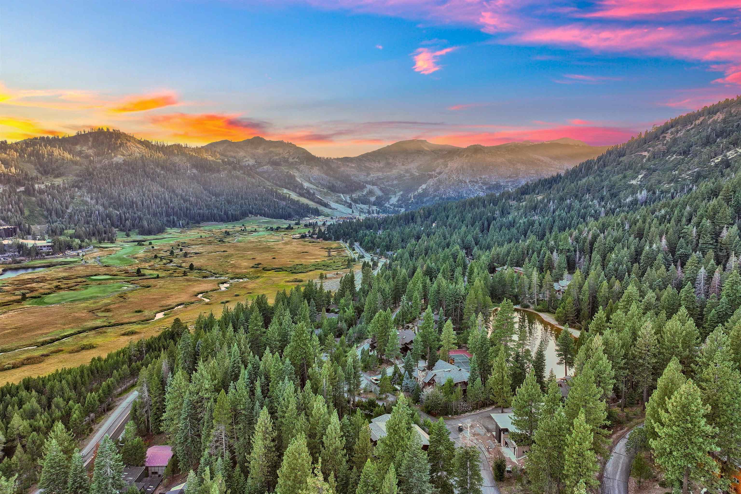 244 Hidden Lake Loop Olympic Valley, CA 96146 - Photo 19 of 20 a view of a lush green hillside and a building