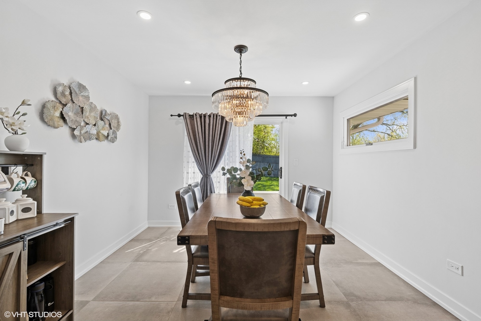 1045 Green Bay Road Lake Bluff, IL 60044 - Photo 12 of 22 a view of a dining room with furniture and a window
