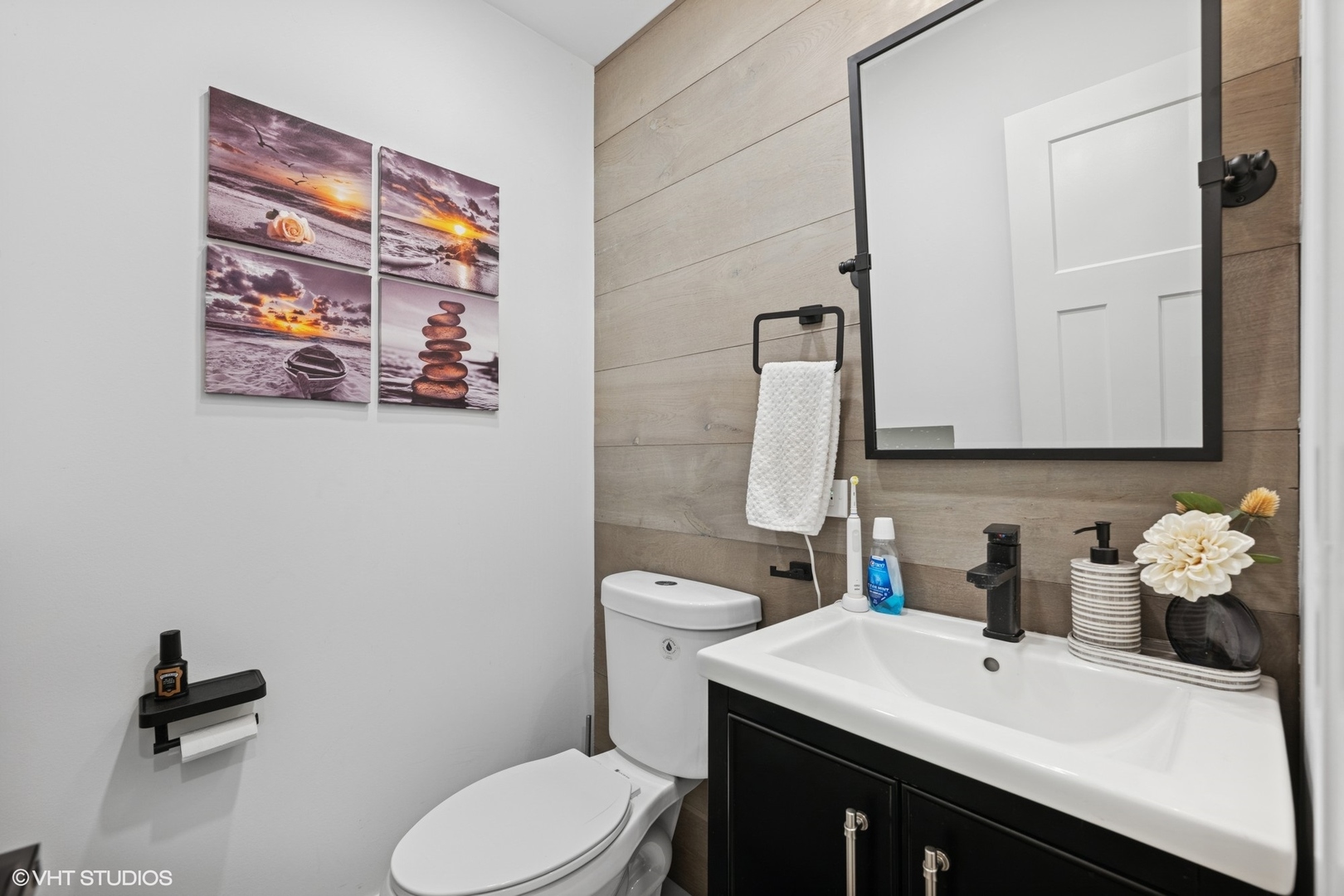1045 Green Bay Road Lake Bluff, IL 60044 - Photo 17 of 22 a bathroom with a sink a toilet and mirror
