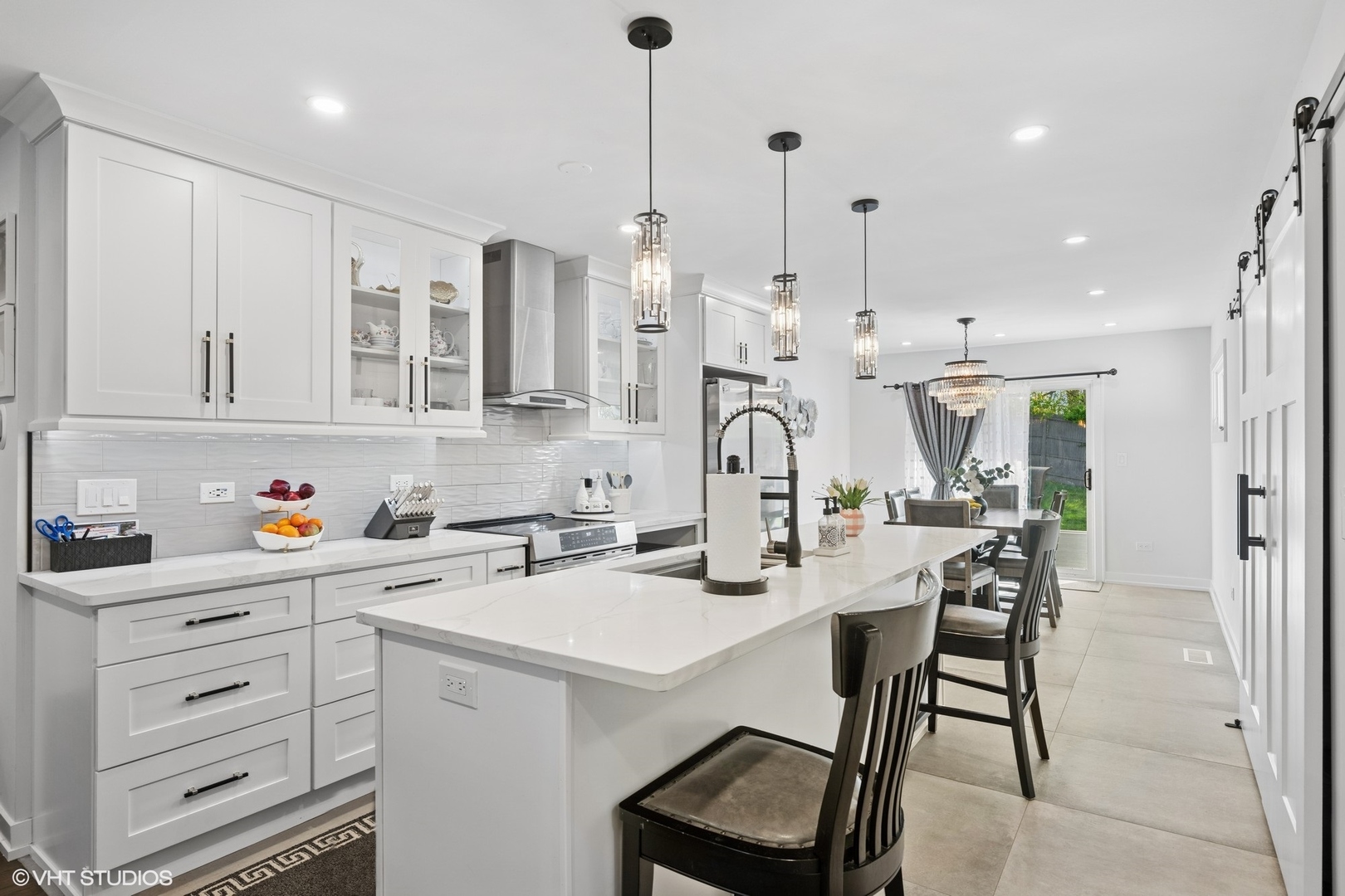 1045 Green Bay Road Lake Bluff, IL 60044 - Photo 9 of 22 a kitchen with stainless steel appliances kitchen island granite countertop a sink a center island and cabinets