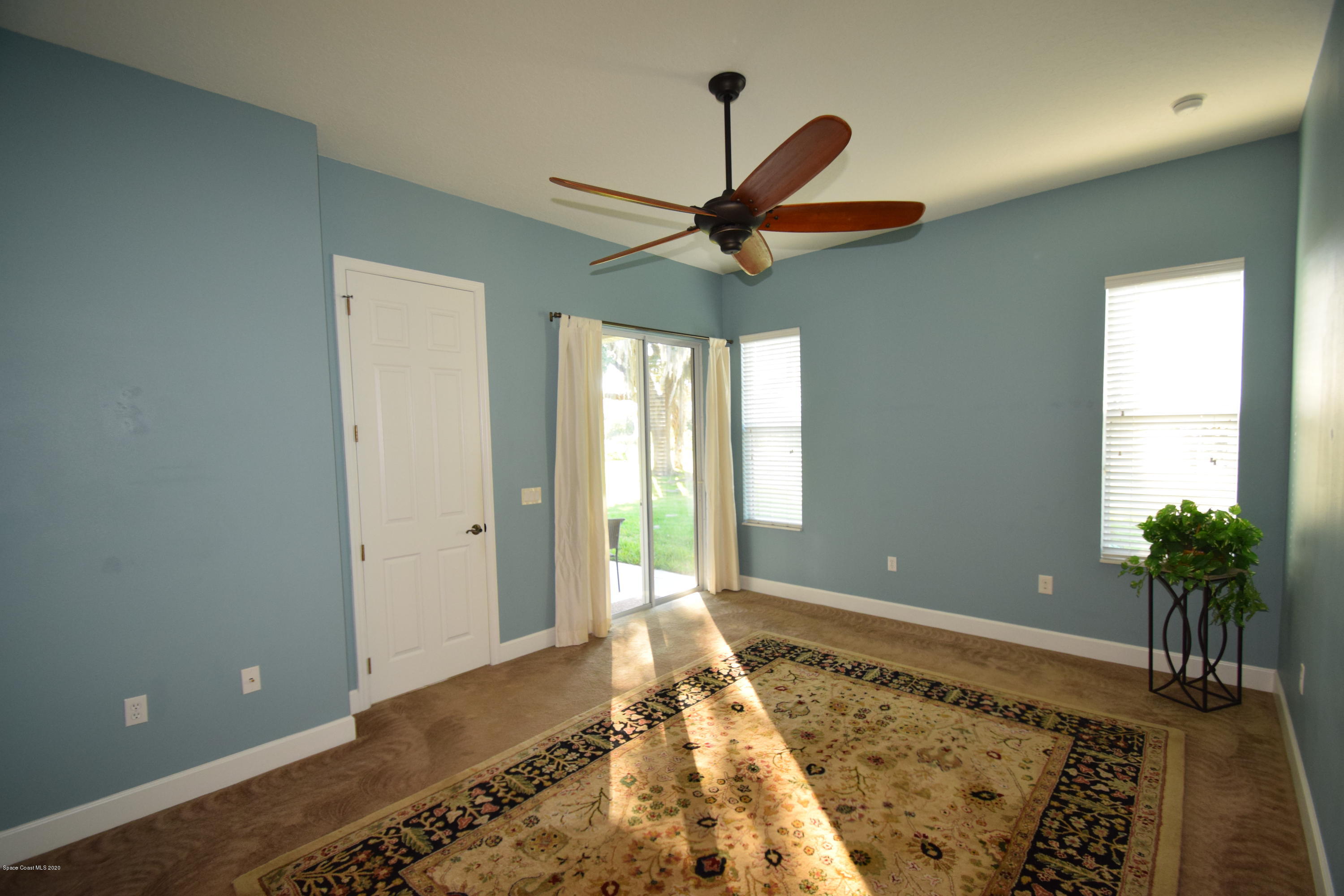 836 Riviera Drive Northeast Palm Bay, FL 32905 - Photo 36 of 75 Slider door access to porch