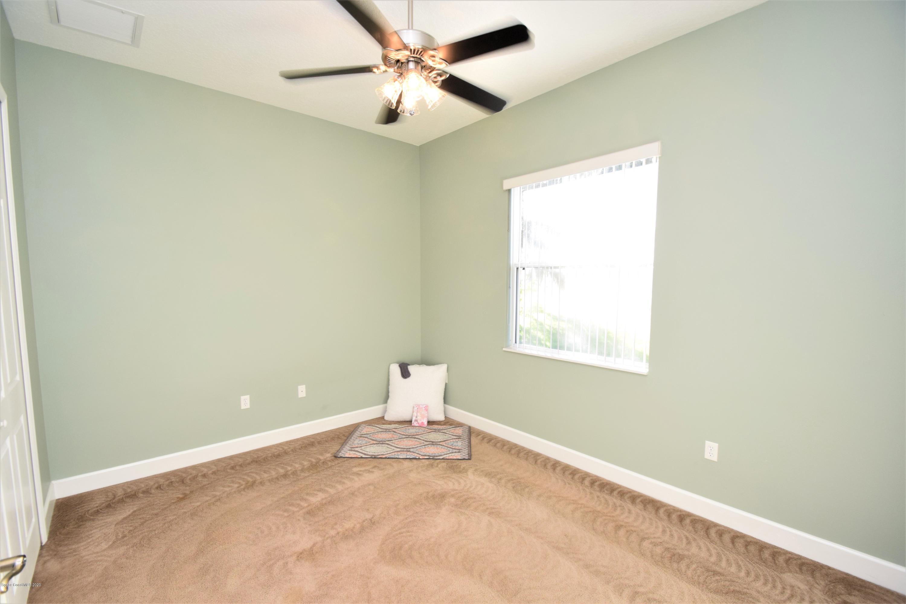 836 Riviera Drive Northeast Palm Bay, FL 32905 - Photo 50 of 75 Bedroom 3
