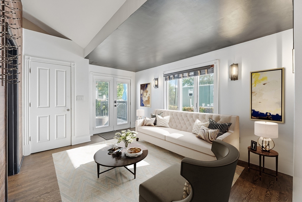 22 Spring Street Everett, MA 02149 - Photo 16 of 40 a living room with furniture and wooden floor