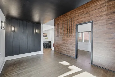 an empty room with wooden floor