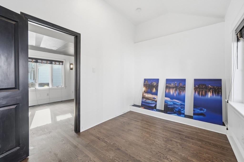 22 Spring Street Everett, MA 02149 - Photo 18 of 40 a view of a bedroom with a wardrobe space
