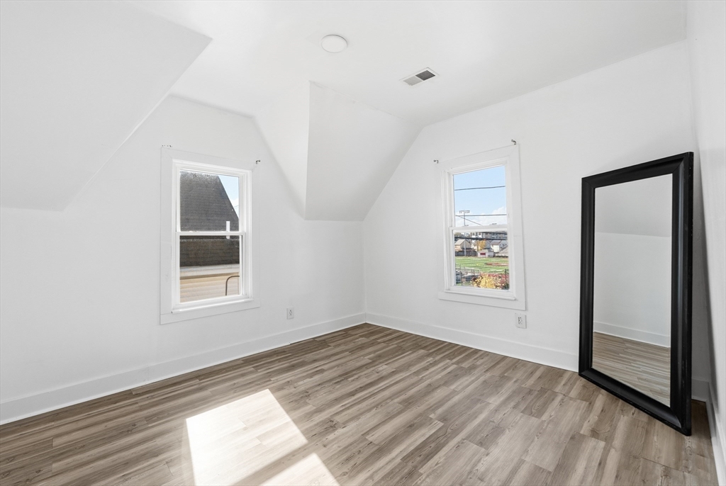 22 Spring Street Everett, MA 02149 - Photo 25 of 40 an empty room with windows
