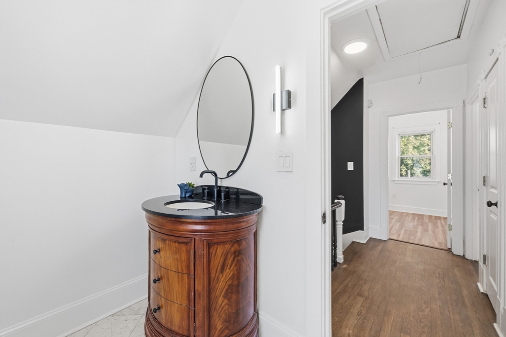 22 Spring Street Everett, MA 02149 - Photo 28 of 40 a very nice looking room with a wooden floor