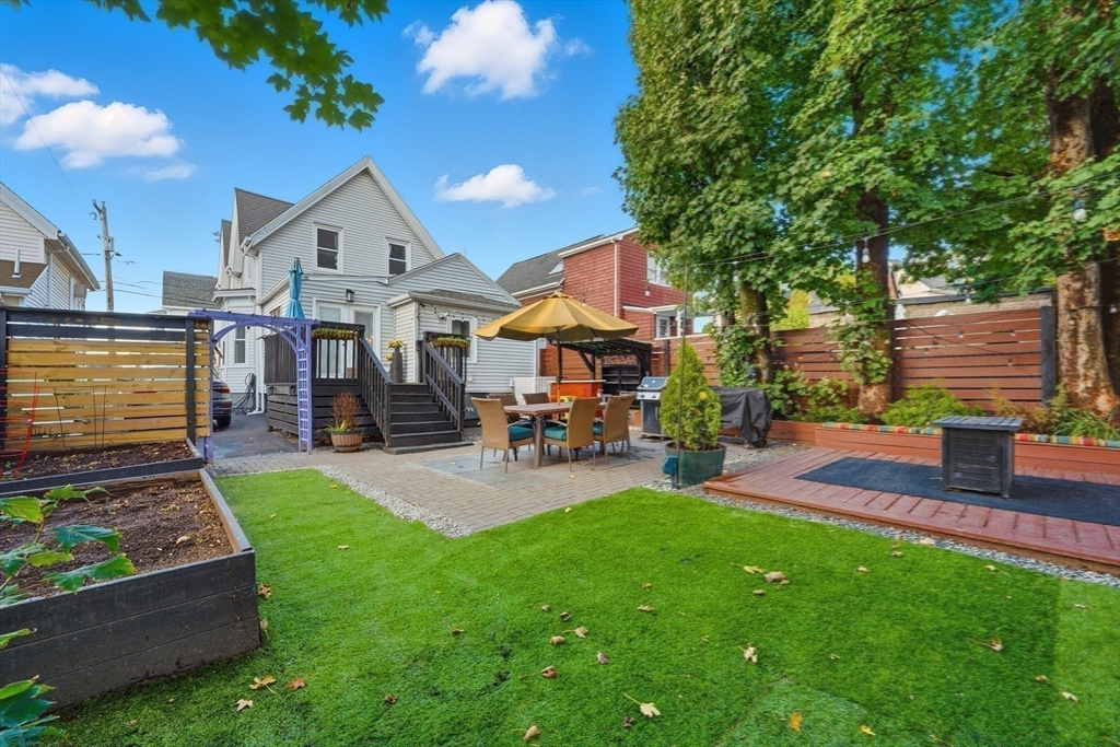 22 Spring Street Everett, MA 02149 - Photo 31 of 40 a view of a house with a patio