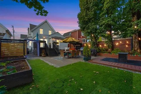 a view of a backyard with sitting area