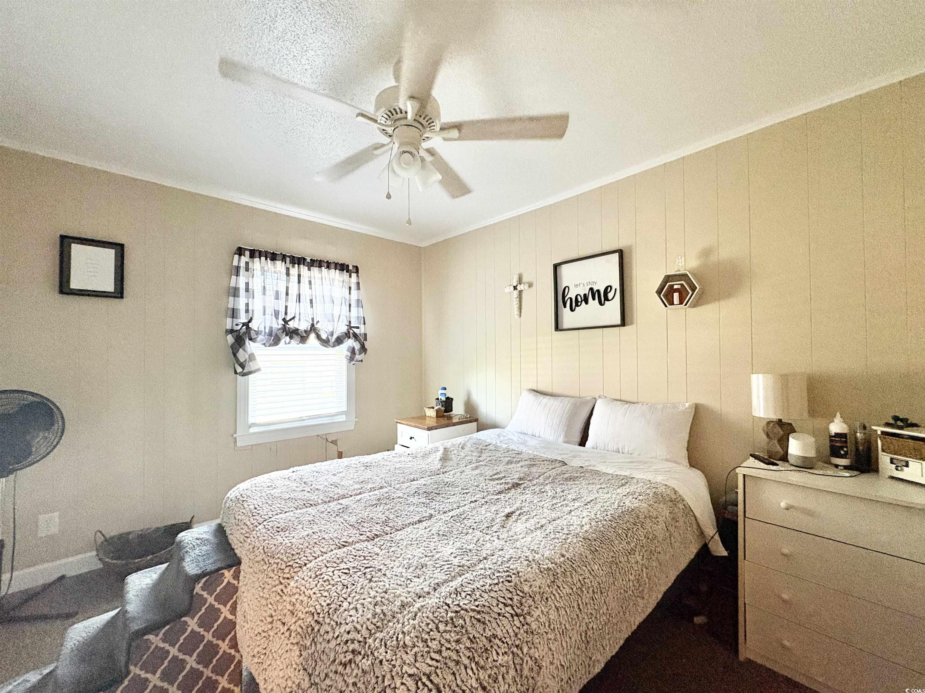 520-526 Boundary Avenue Murrells Inlet, SC 29576 - Photo 12 of 38 Bedroom with a textured ceiling, ornamental molding, and ceiling fan