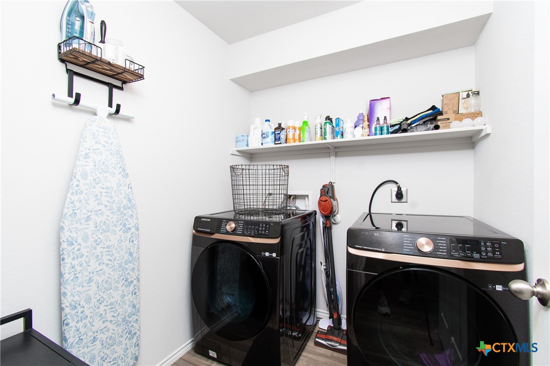 8415 Cantera Rdg Road Temple, TX 76502 - Photo 11 of 24 a utility room with dryer washer and storage