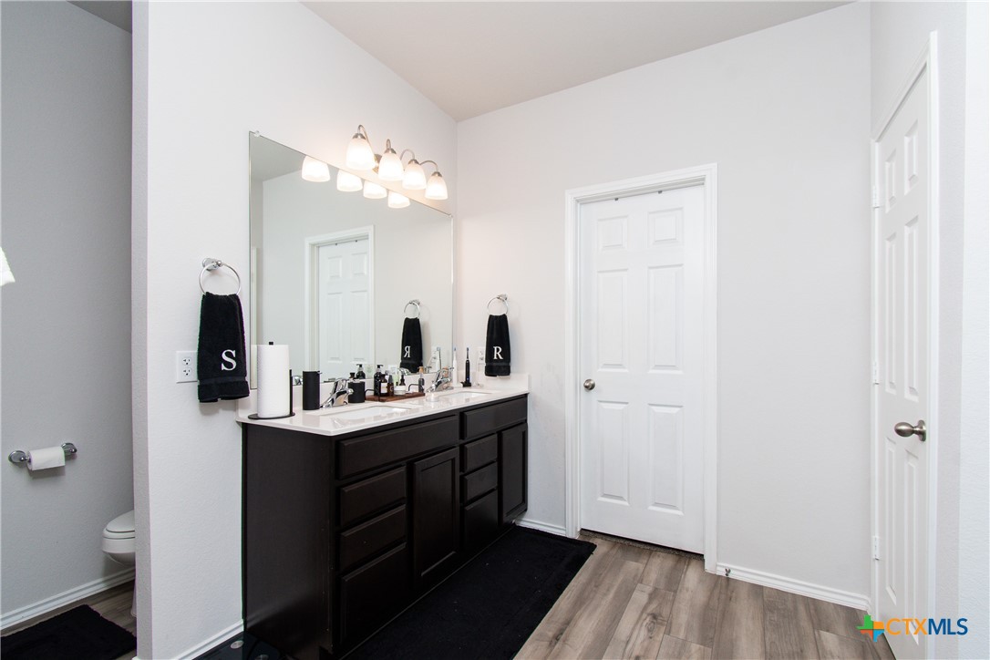 8415 Cantera Rdg Road Temple, TX 76502 - Photo 16 of 24 a bathroom with a sink mirror and vanity