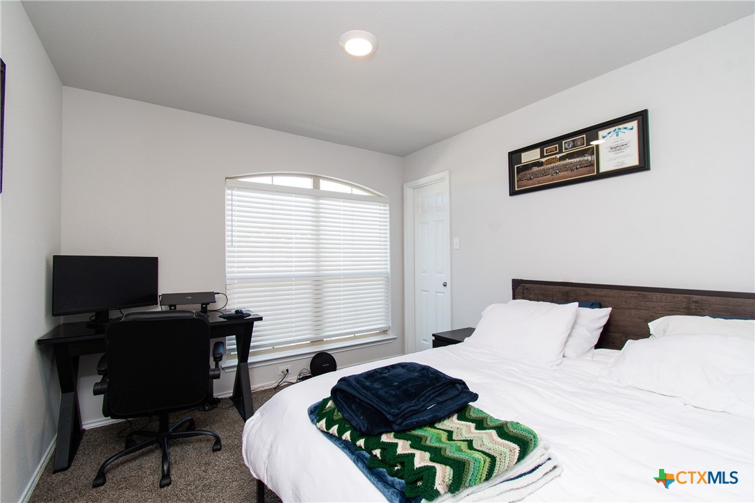 8415 Cantera Rdg Road Temple, TX 76502 - Photo 18 of 24 a bedroom with a bed and a desk