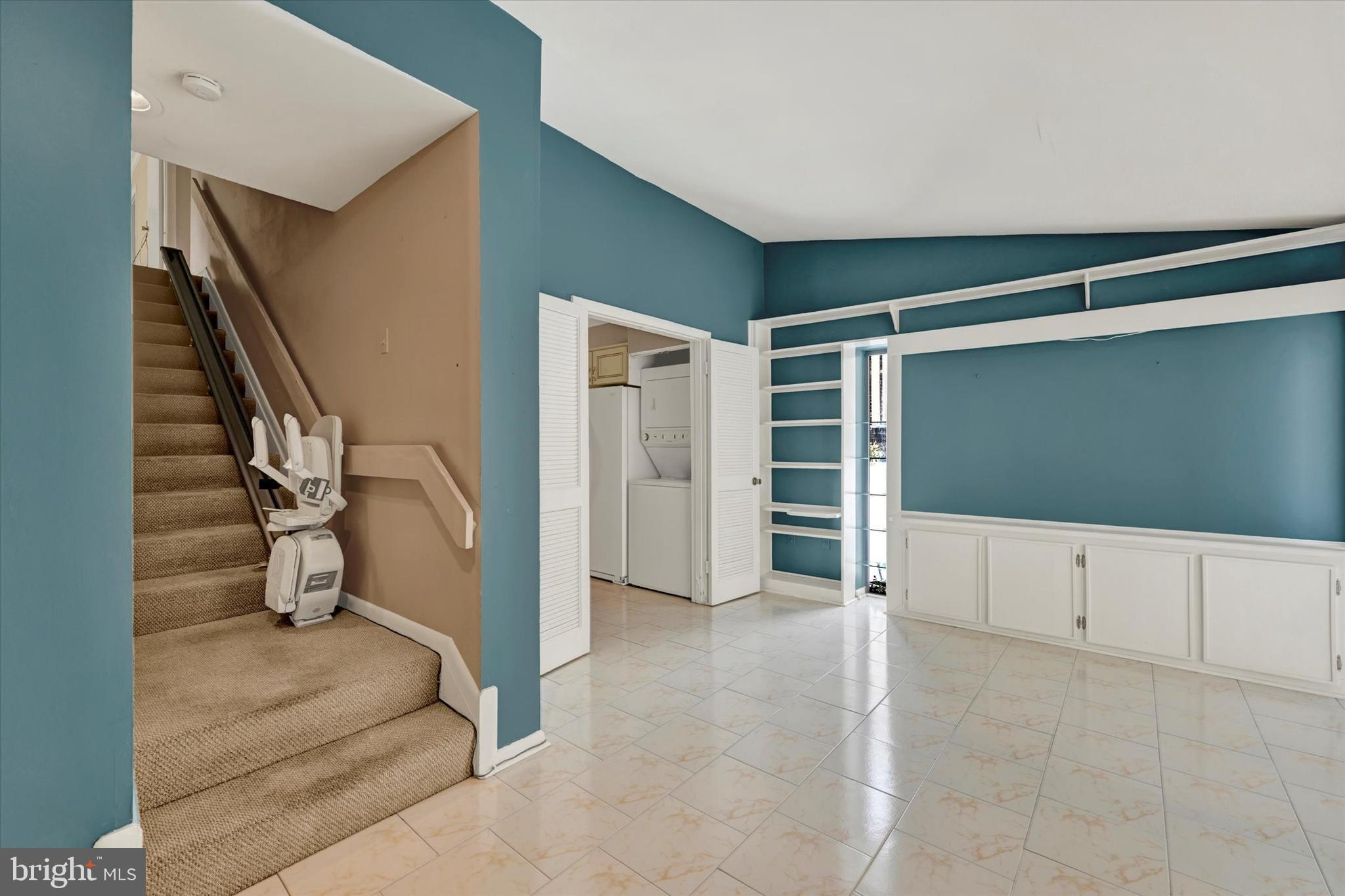25 Tanner Court, Unit H Baltimore, MD 21208 - Photo 17 of 29 a view of an empty room with stairs and toys