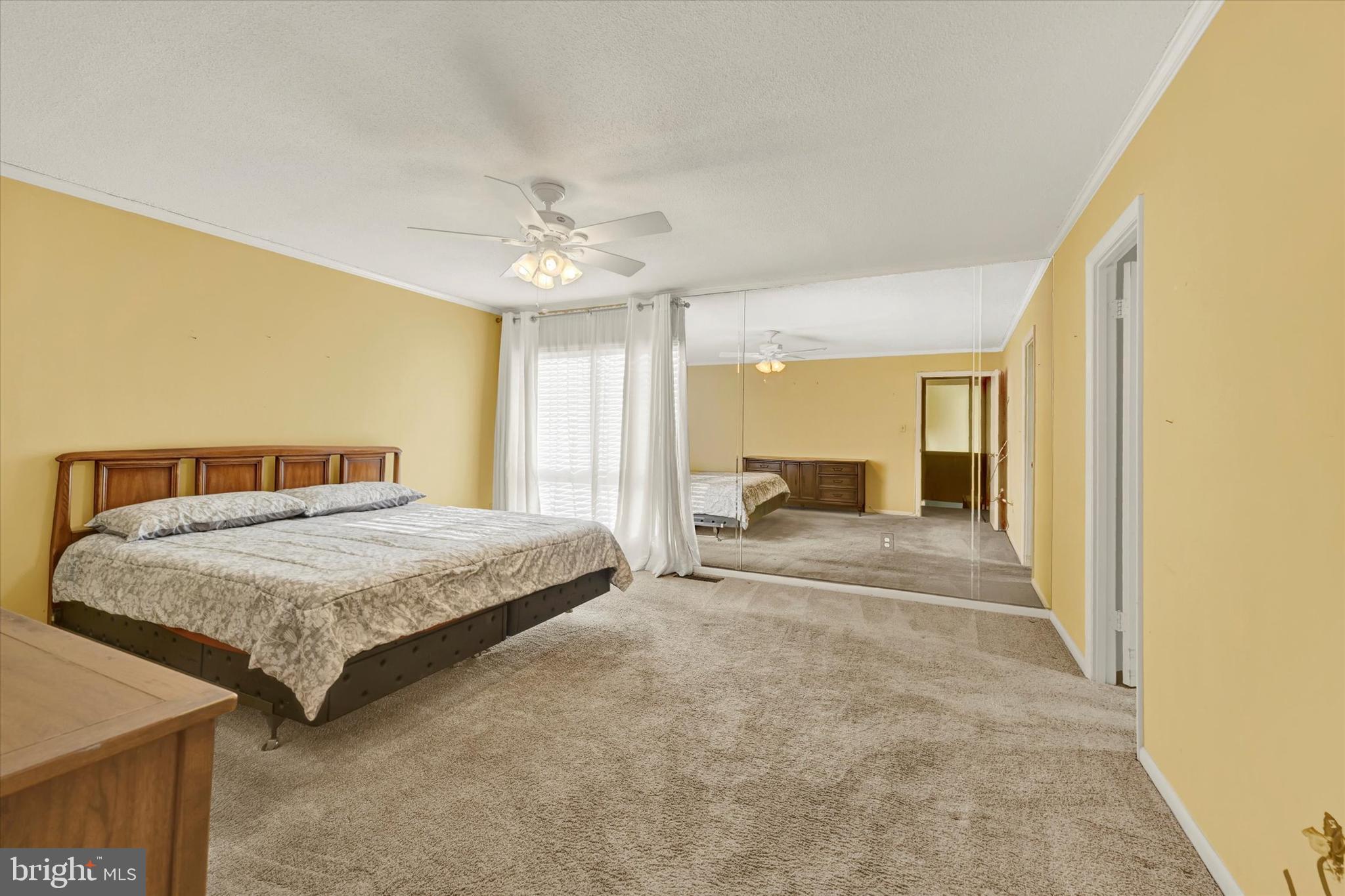 25 Tanner Court, Unit H Baltimore, MD 21208 - Photo 18 of 29 a spacious bedroom with a bed and window