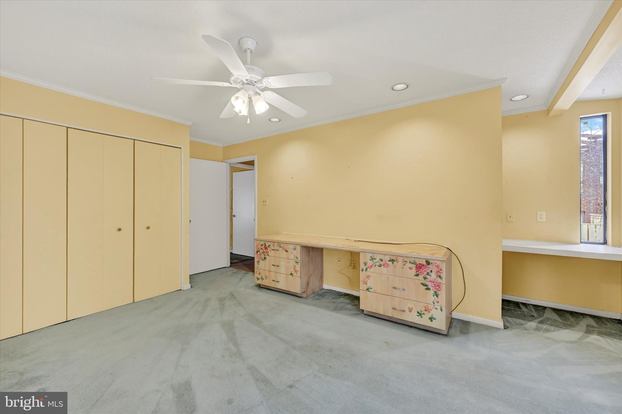 25 Tanner Court, Unit H Baltimore, MD 21208 - Photo 23 of 29 a view of an empty room with a window
