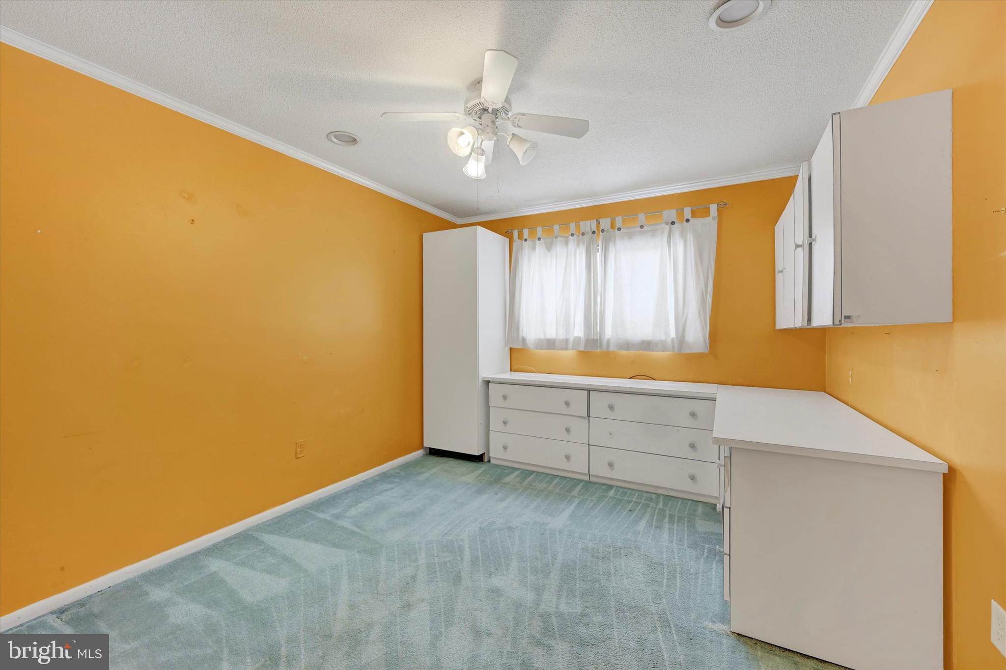 25 Tanner Court, Unit H Baltimore, MD 21208 - Photo 24 of 29 a room with window and cabinet