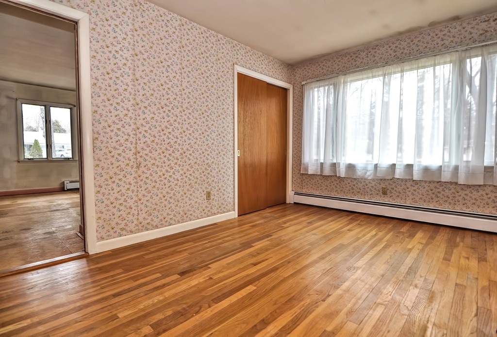 80 Goldthwaite Road Northbridge, MA 01588 - Photo 12 of 28 an empty room with wooden floor and windows