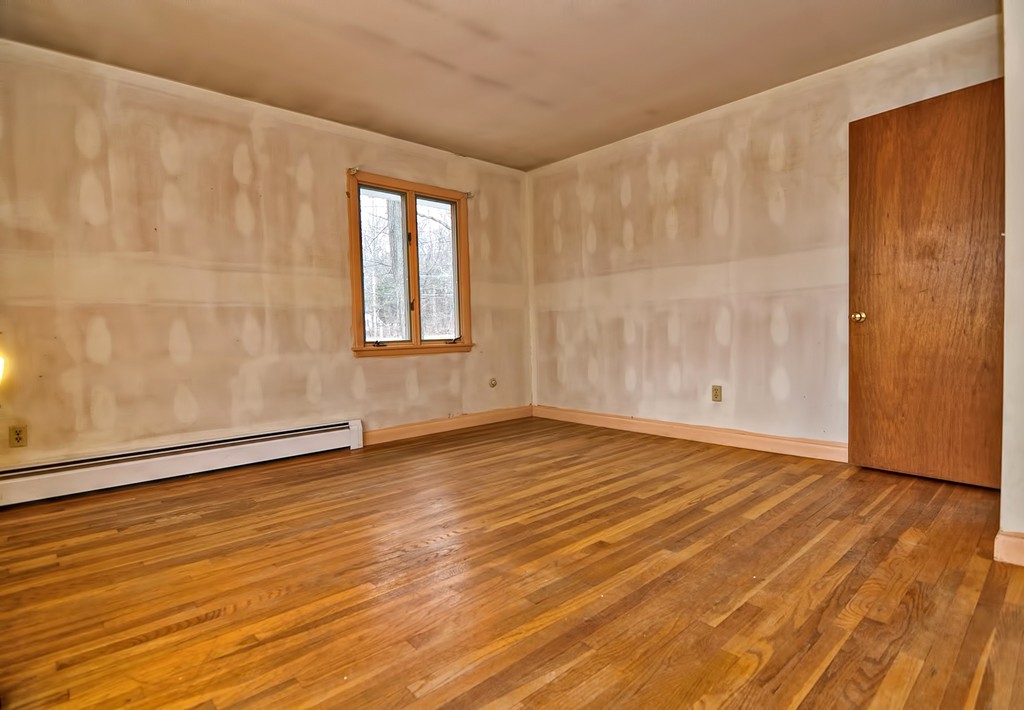 80 Goldthwaite Road Northbridge, MA 01588 - Photo 16 of 28 a view of an empty room with wooden floor and a window
