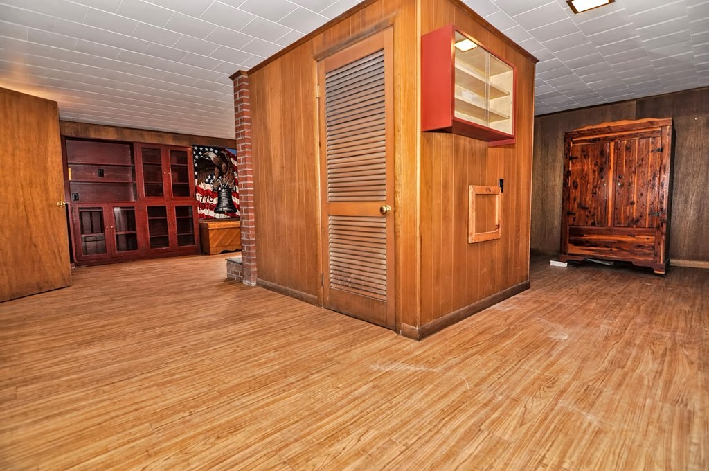 80 Goldthwaite Road Northbridge, MA 01588 - Photo 22 of 28 a view of livingroom with an empty room with wooden floor and closet