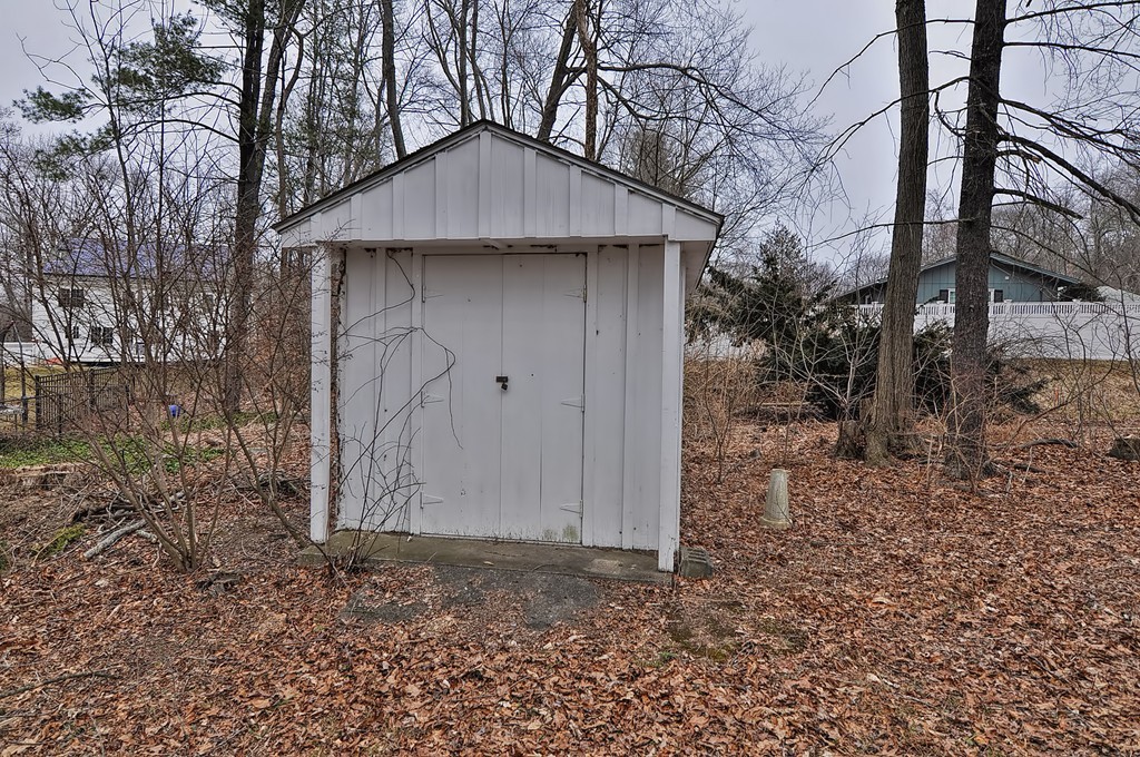 80 Goldthwaite Road Northbridge, MA 01588 - Photo 25 of 28 a house with trees in the background