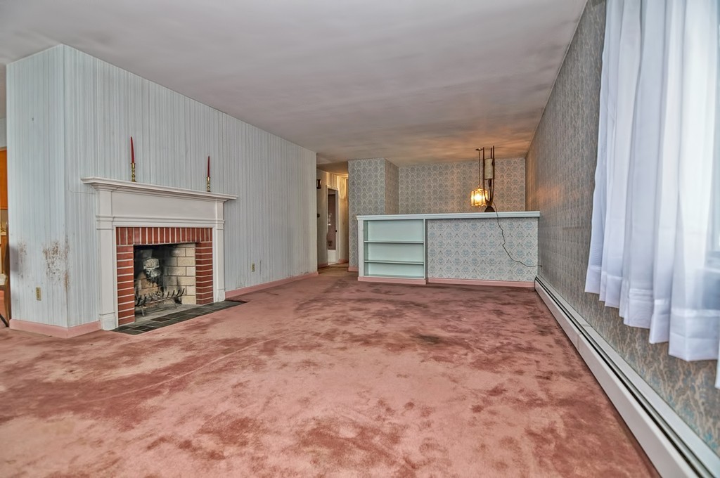 80 Goldthwaite Road Northbridge, MA 01588 - Photo 10 of 28 a view of empty room with wooden floor and fireplace