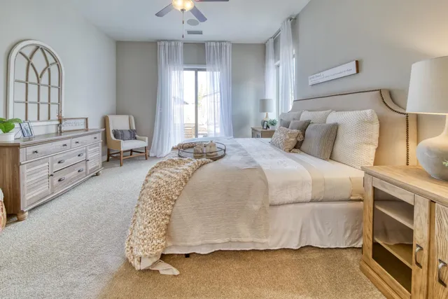 a bathroom with a tub sink shower and mirror