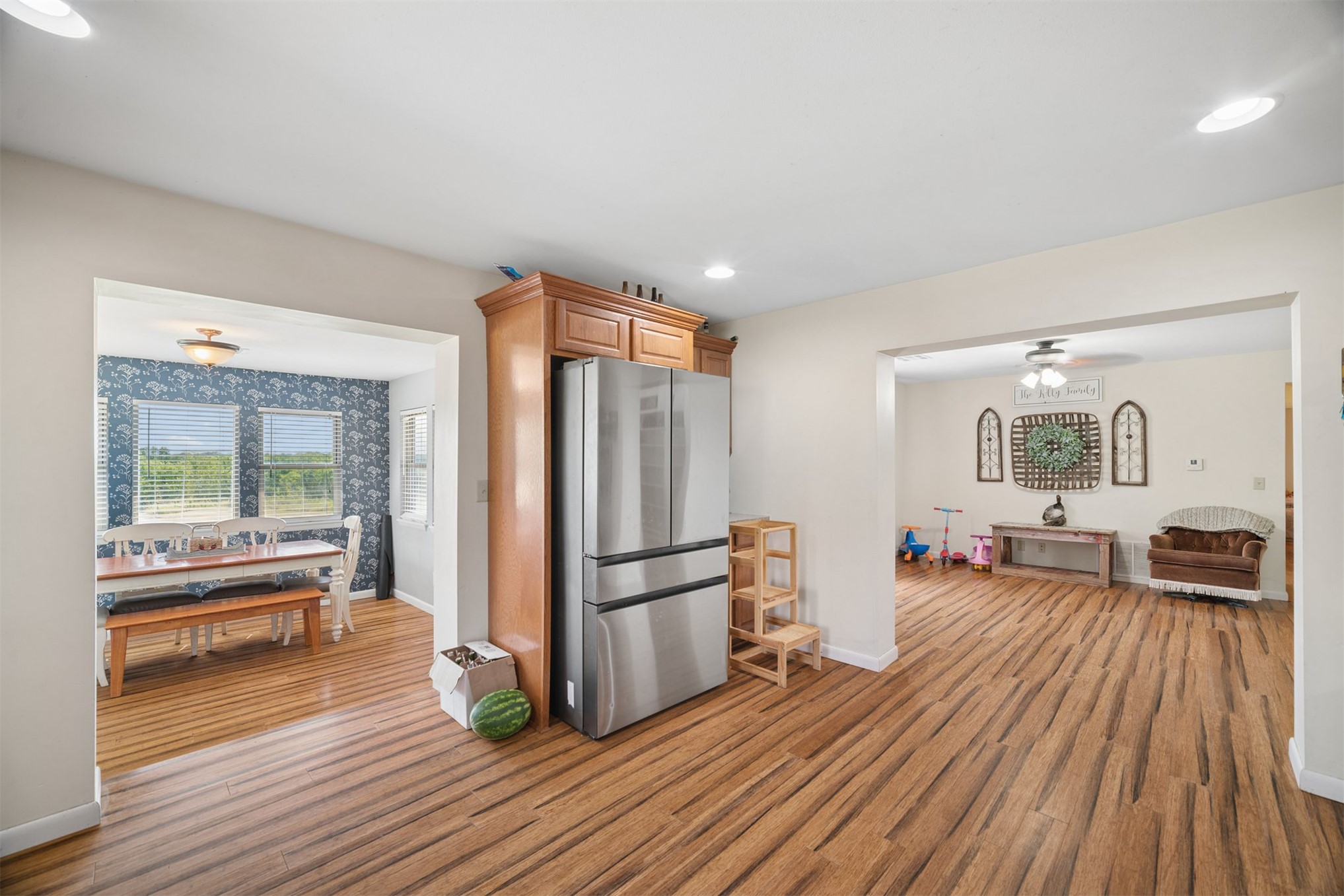 49301 South 360 Road Pawnee, OK 74058 - Photo 11 of 44 Wood-finish flooring throughout, stainless steel refrigerator, recessed lighting, and a dining area with multiple windows