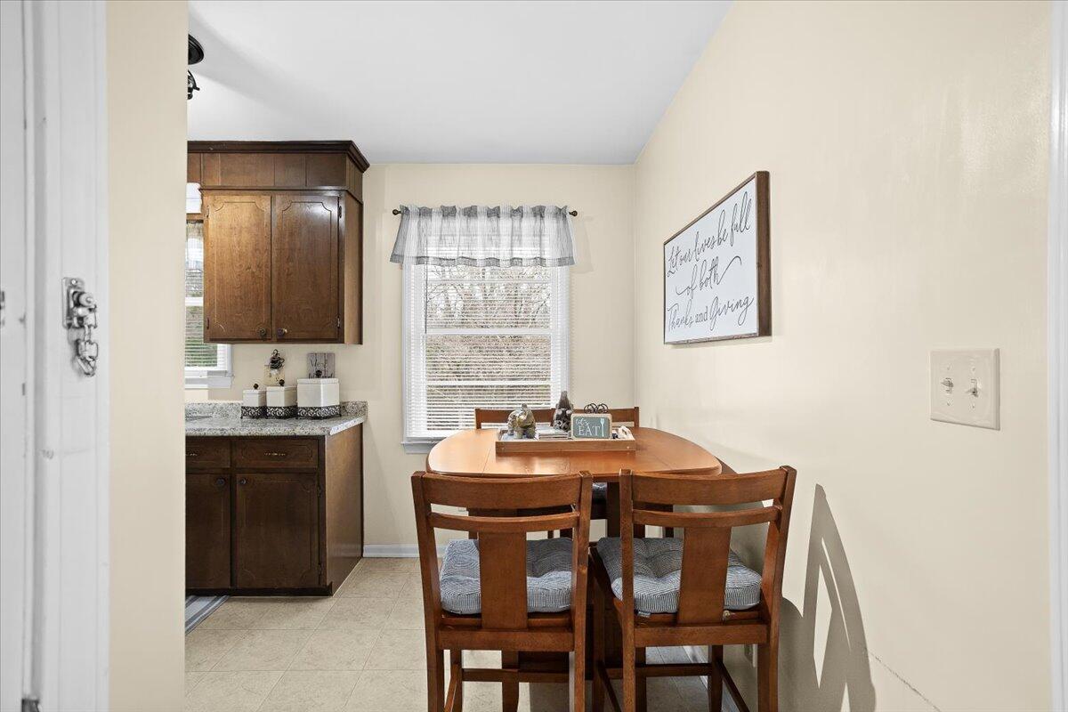 2321 Meadowbrook Road Northwest Roanoke, VA 24017 - Photo 8 of 25 a view of a dining room with furniture and window