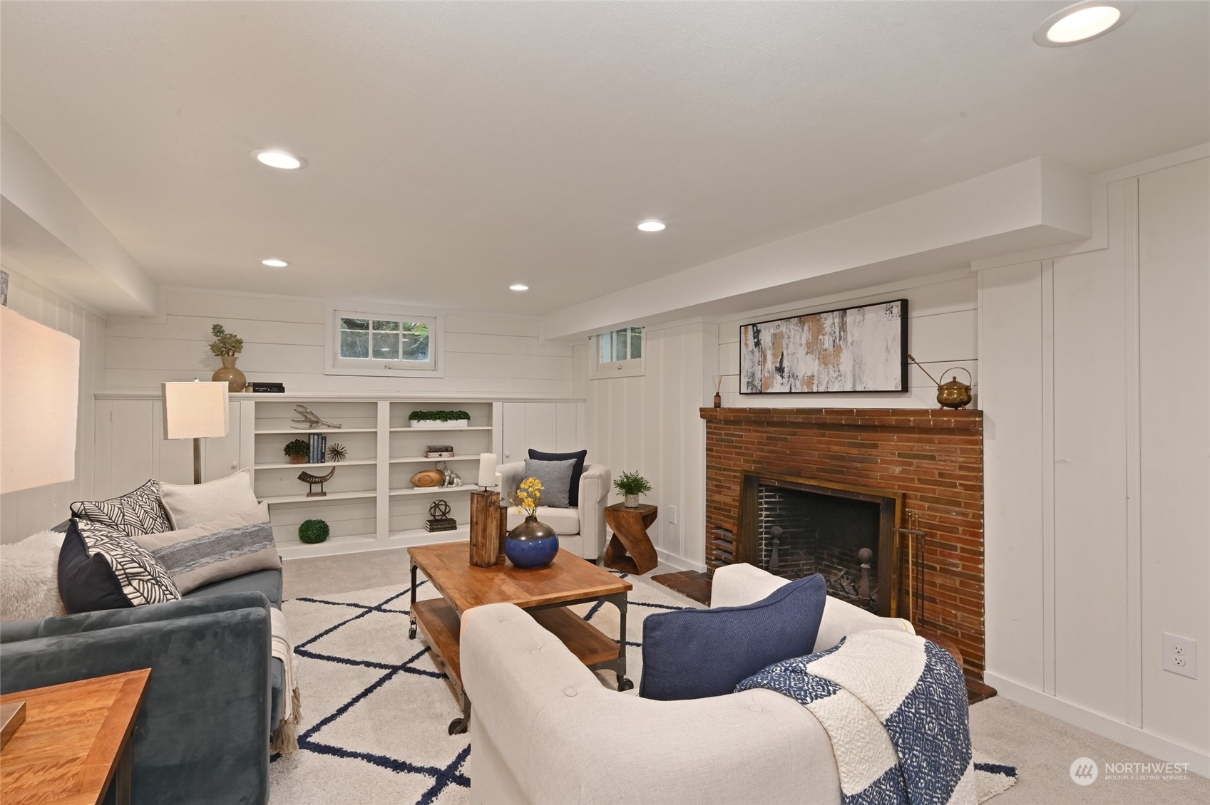 2602 29th Avenue West Seattle, WA 98199 - Photo 25 of 39 a living room with furniture and a fireplace