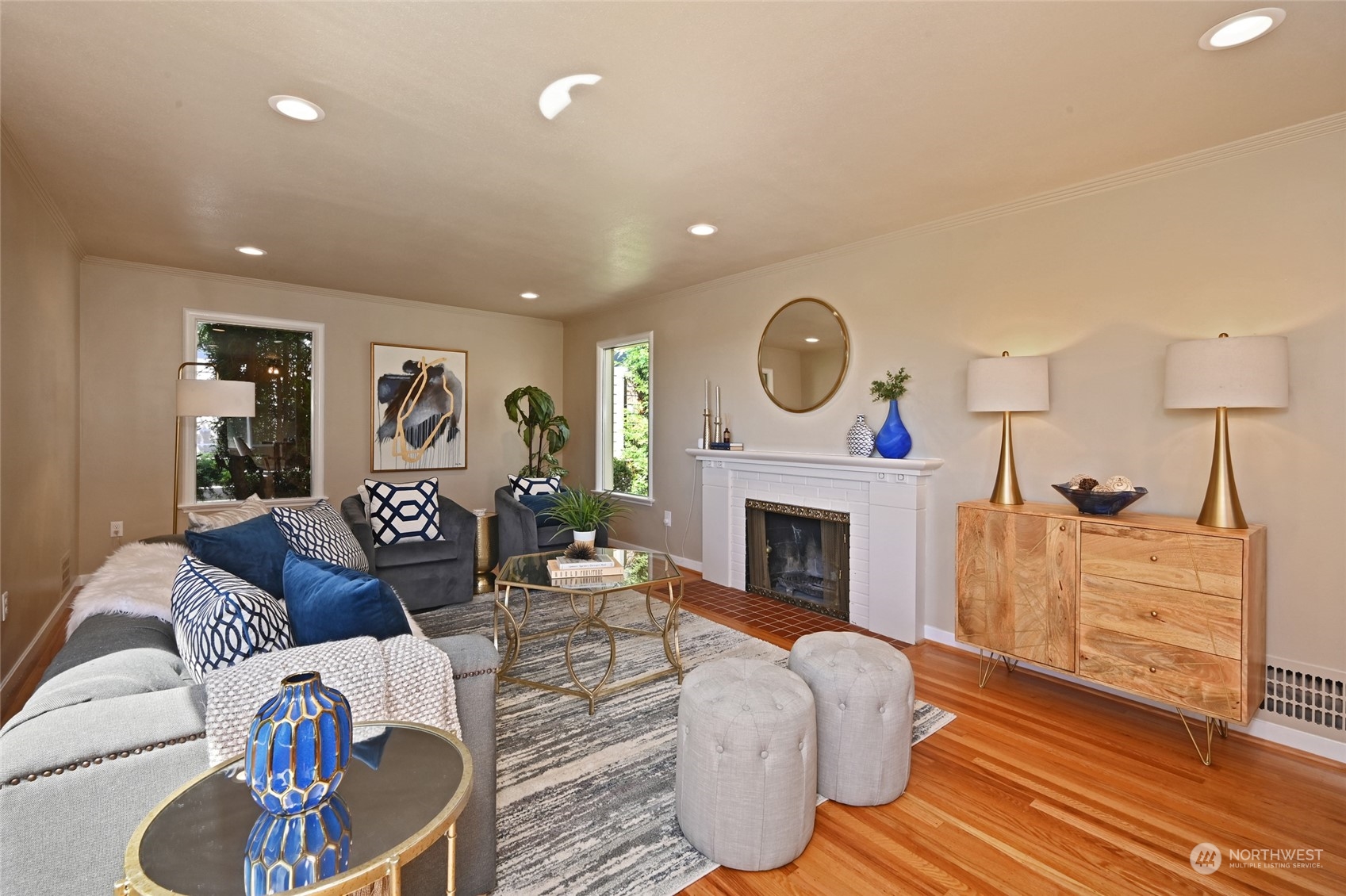 2602 29th Avenue West Seattle, WA 98199 - Photo 4 of 39 a living room with furniture a fireplace and a potted plant