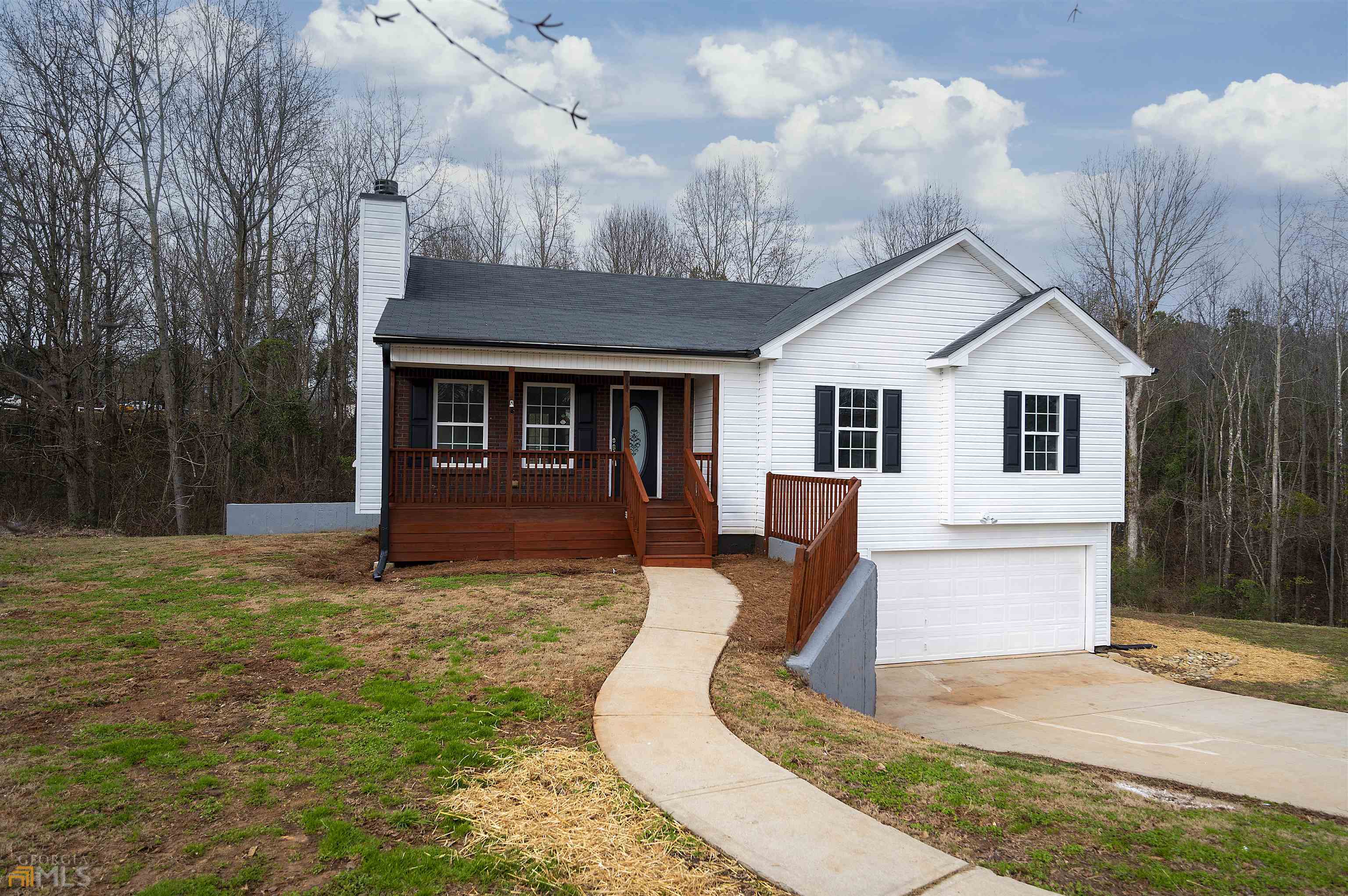 a front view of a house with yard