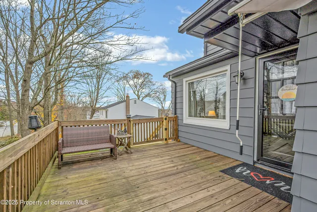 a view of a livingroom with furniture and a flat screen tv