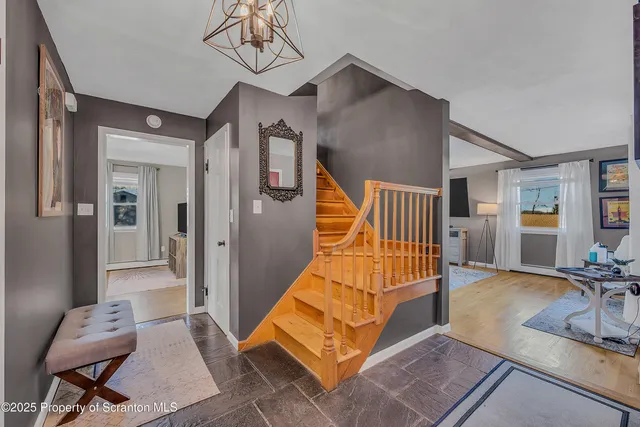 a view of a workspace with furniture and window