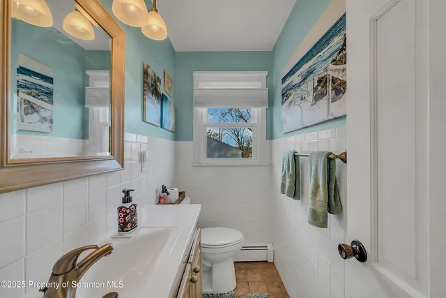 a bedroom with a bed and table