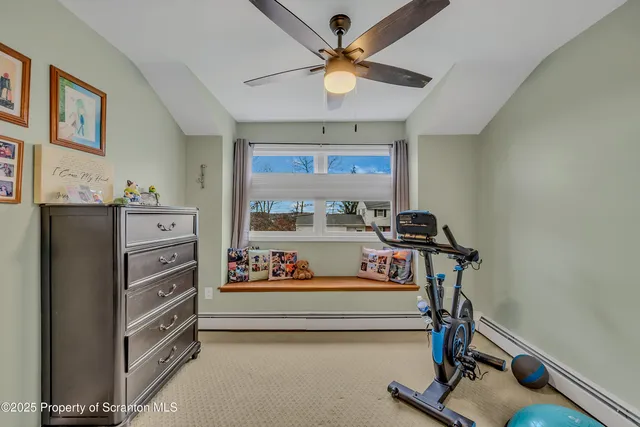 a bathroom with a sink a toilet a mirror and shower