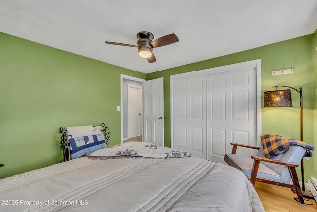 a living room with furniture and a book shelf