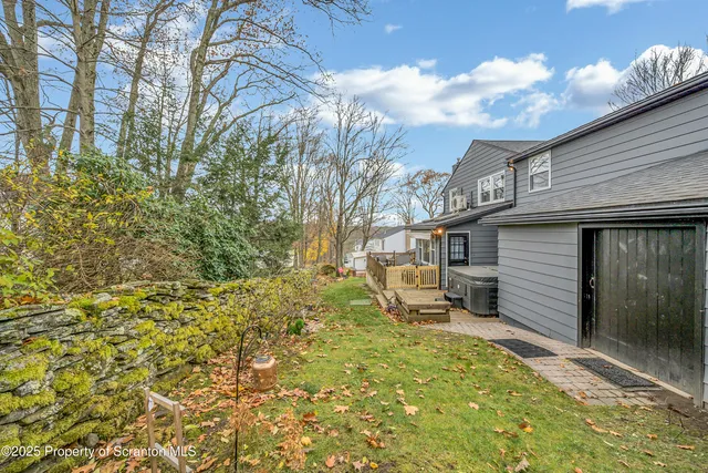 a view of a balcony with wooden floor and outdoor space
