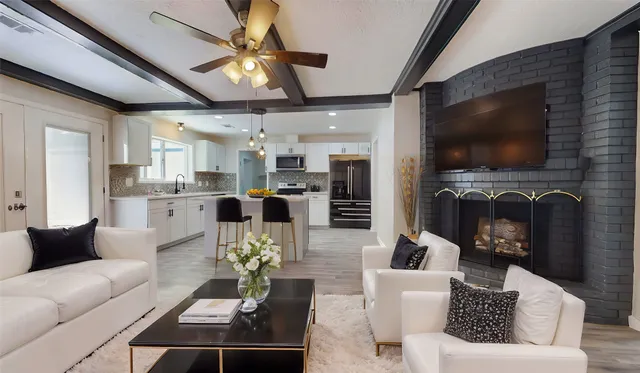 a living room with furniture and a flat screen tv