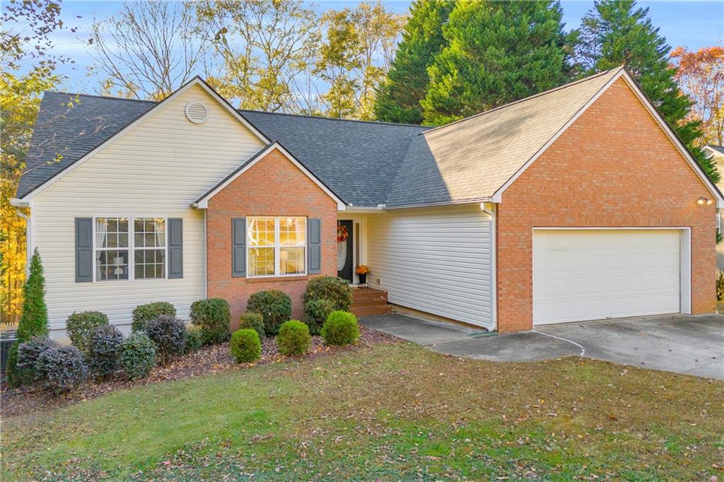 1670 Alcovy River Drive Dacula, GA 30019 - Photo 1 of 43 a view of a house with backyard and garden