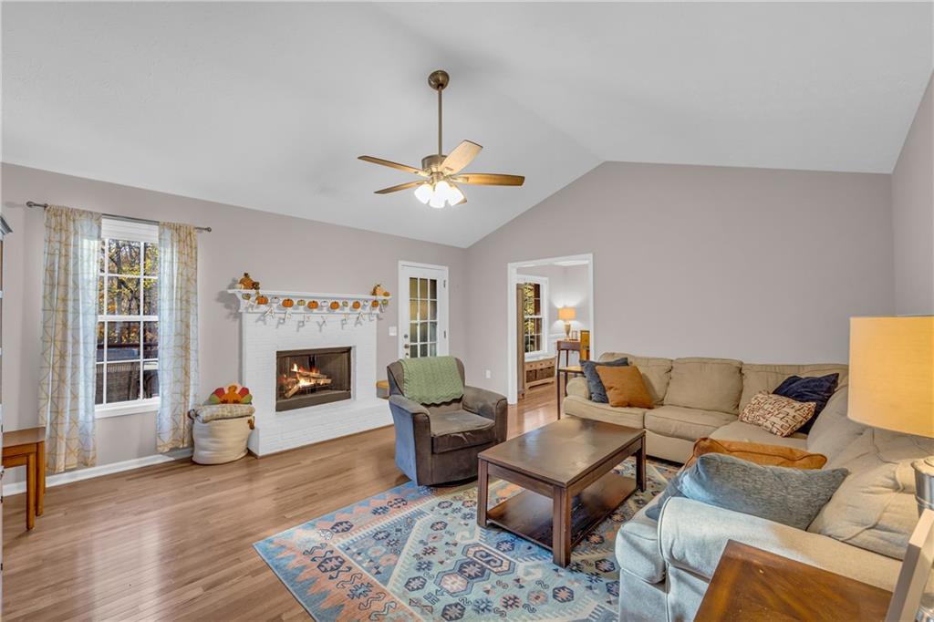 1670 Alcovy River Drive Dacula, GA 30019 - Photo 14 of 43 a living room with furniture and a fireplace