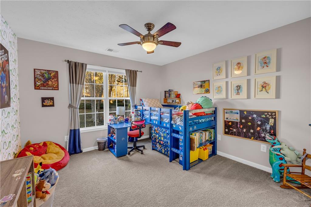 1670 Alcovy River Drive Dacula, GA 30019 - Photo 18 of 43 a children room with toys and a fan