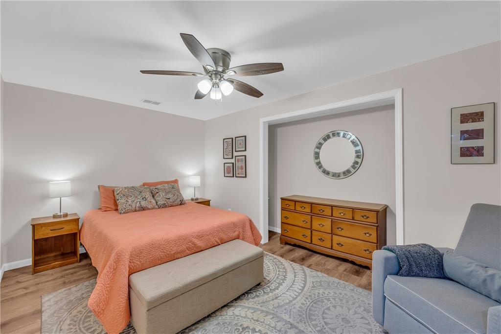 1670 Alcovy River Drive Dacula, GA 30019 - Photo 30 of 43 a bedroom with a bed couch and window